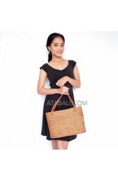 Women ata handwoven bag with wire leather handle